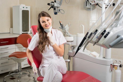 dental hygienist in dental chair